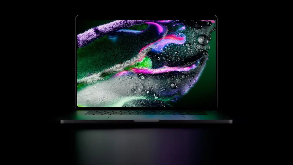 Apple's new MacBook Pro with an OLED display showing colorful abstract artwork against a black background