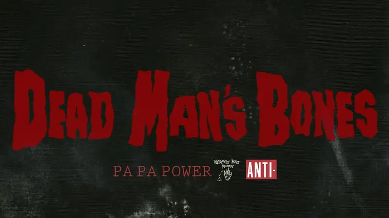 Official Dead Man's Bones Pa Pa Power artwork from Anti- Records: the band's name in jagged red lettering on a dark, textured background