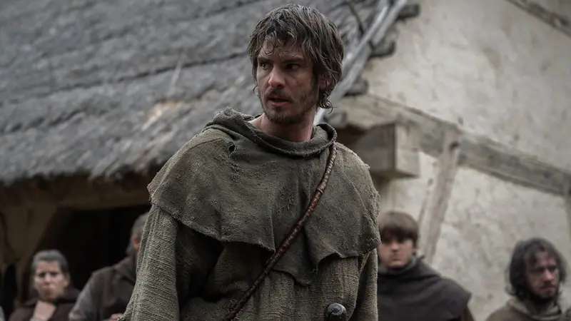 Andrew Garfield as the Ploughman in a medieval village, still from the film The Uprising