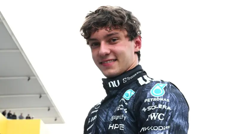 Mercedes driver Kimi Antonelli smiling in team overalls, official Formula 1 photo